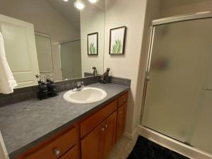 a bathroom with a sink and a shower at Cozy Two Bedrooms House in Beaverton in Beaverton +34 photos