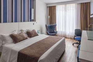 Postel nebo postele na pokoji v ubytování Radisson Hotel Curitiba