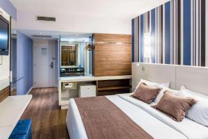 Postel nebo postele na pokoji v ubytování Radisson Hotel Curitiba