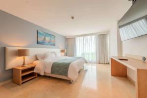 Кровать или кровати в номере Radisson Cartagena Ocean Pavillion Hotel