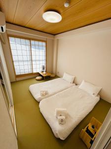 Letto o letti in una camera di 德川 CU Host CASA