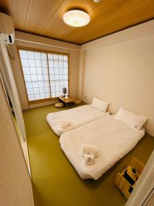 Letto o letti in una camera di 德川 CU Host CASA
