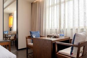 Xiamen Minyi International Hotel的电视和/或娱乐中心