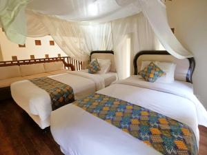 Ένα ή περισσότερα κρεβάτια σε δωμάτιο στο Sayang Taman Villas +111 φωτογραφίες