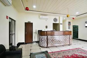 a lobby with a reception desk in a building at Hotel Dior Near Jal Mahal, Jaipur in Jaipur