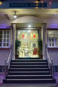 a front door of a house with stairs in front at Hotel Dior Near Jal Mahal, Jaipur in Jaipur
