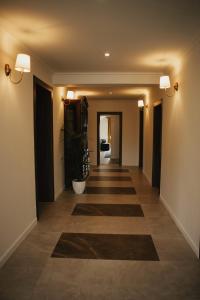 a hallway of a house with a long hallway at Vila Slavonika in Slavonski Brod