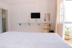 Postel nebo postele na pokoji v ubytování B&B Chiangrai