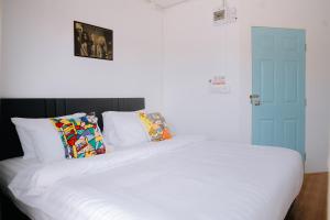 Postel nebo postele na pokoji v ubytování B&B Chiangrai