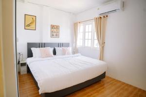 Postel nebo postele na pokoji v ubytování B&B Chiangrai