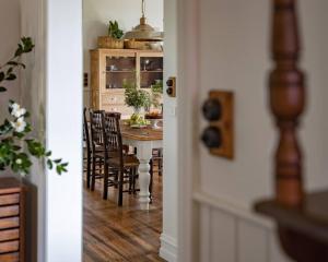 a dining room with a table and chairs in a kitchen at Borradale Stanley in Stanley