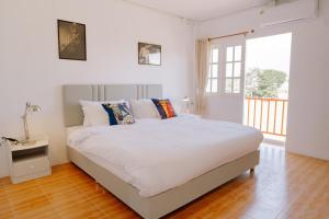 Postel nebo postele na pokoji v ubytování B&B Chiangrai