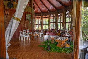 a large room with tables and chairs in a restaurant at GHION HOTEL in Addis Ababa