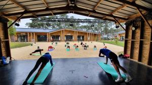 a group of people doing yoga in a gym at SevServices aux Dunes de Contis in Saint-Julien-en-Born