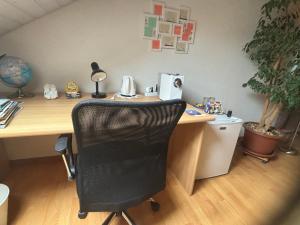 an office with a desk with a black chair at Queen Guest Room in Mont-sur-Rolle
