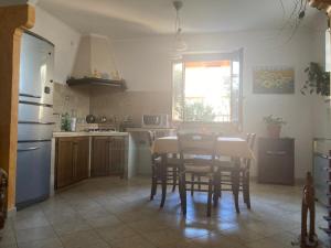 Kuchyň nebo kuchyňský kout v ubytování Delizioso appartamento in villa tra mare e città + 12 fotografií