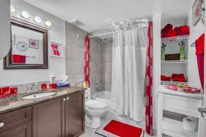 a bathroom with a toilet sink and a shower at 33 Executive Home, Ac, Airport in Calgary +77 photos
