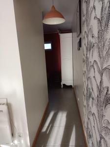 a hallway with a toilet in a room at Studio plein pied in Liévin