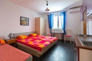Postel nebo postele na pokoji v ubytování Apartment Pero
