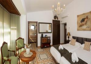 Postel nebo postele na pokoji v ubytování Art Boutique La Casona de las Flores