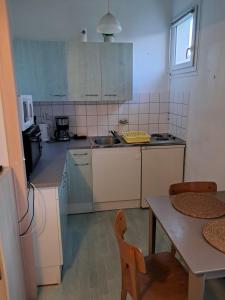 Kuchyň nebo kuchyňský kout v ubytování Le porquerolle + 4 fotografie