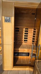 a glass door of a room with a stove at Chalet Kultique in Innerschwand am Mondsee
