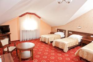 Posteľ alebo postele v izbe v ubytovaní Hotel Arkadia Royal + 37 fotografií