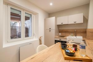a kitchen with a table with a bowl of food on it at Gîte Hirond'Elsass in Beblenheim