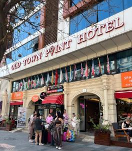 people standing outside of an old town spirit hotel at Old Town Point Hotel & Spa Antalya in Antalya