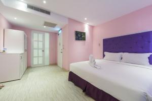 Ένα ή περισσότερα κρεβάτια σε δωμάτιο στο Lion King Hotel