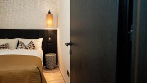 Postel nebo postele na pokoji v ubytování Relais Santa Lucia - Appartamenti Luxury e Premium