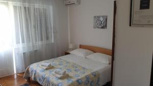 Postel nebo postele na pokoji v ubytování Accomodation Mirjana Rooms