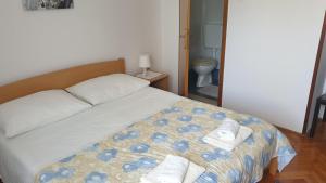 Postel nebo postele na pokoji v ubytování Accomodation Mirjana Rooms