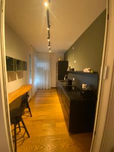 a kitchen with a sink and a table in it at Appartamento Venezia Mestre in Venice