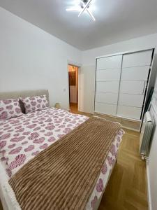 Postel nebo postele na pokoji v ubytování Aleksandra