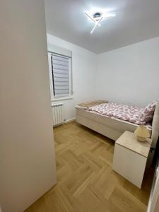 Postel nebo postele na pokoji v ubytování Aleksandra