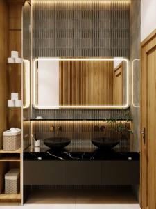 a bathroom with two sinks and a mirror at Nội homestay in Hue +52 photos