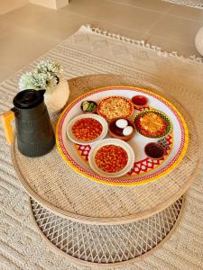 a table with a plate of food on a table at alsaif camp in Bidiyah