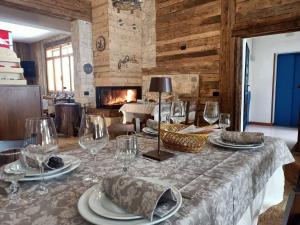 a dining room with a table with wine glasses at Hotel Polle Life in Riolunato