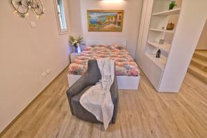 Postel nebo postele na pokoji v ubytování Appartamento Promontorio - Theater Home + 8 fotografií