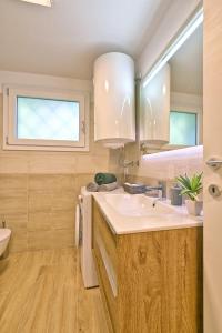 Koupelna v ubytování Appartamento Promontorio - Theater Home