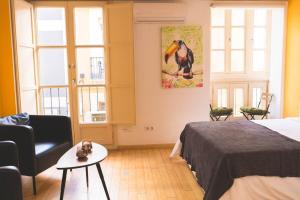 Posteľ alebo postele v izbe v ubytovaní Céntrico Estudio - Málaga centro