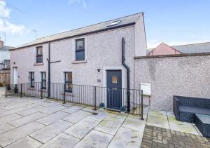 a white brick building with a black fence at Modern 2 bedroom Flat in Montrose in Montrose