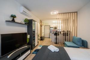 Et tv og/eller underholdning på MyFlat Coral Suite