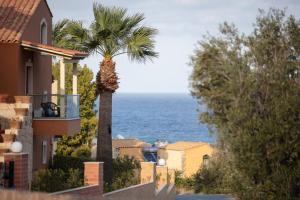 a view of the ocean from a house at Dia Apartments in Hersonissos