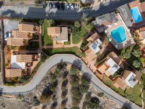 an overhead view of a house with a pool at Dia Apartments in Hersonissos