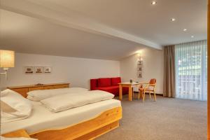 Postel nebo postele na pokoji v ubytování Hotel Erika
