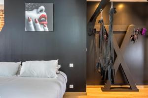 Postel nebo postele na pokoji v ubytování Nuits secrètes un instant privilégié et sensuel
