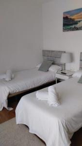 Кровать или кровати в номере Aloka rooms Sopela