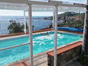 a swimming pool with a view of the ocean at Villa del Mare Ligure Terme & SPA Piscina a 37 gradi in Santo Stefano al Mare